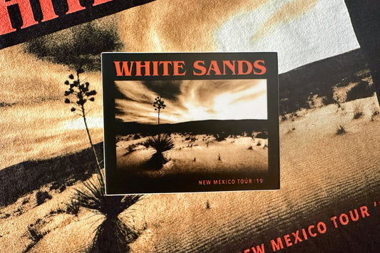 Sticker for 'White Sands' with desert landscape and cacti.