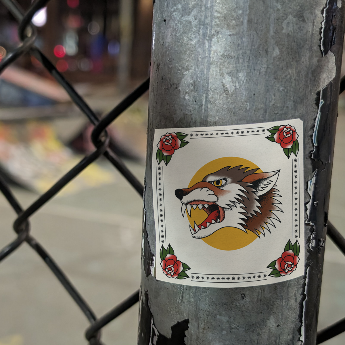 An illustration of a wolf, hanging on a metal fence