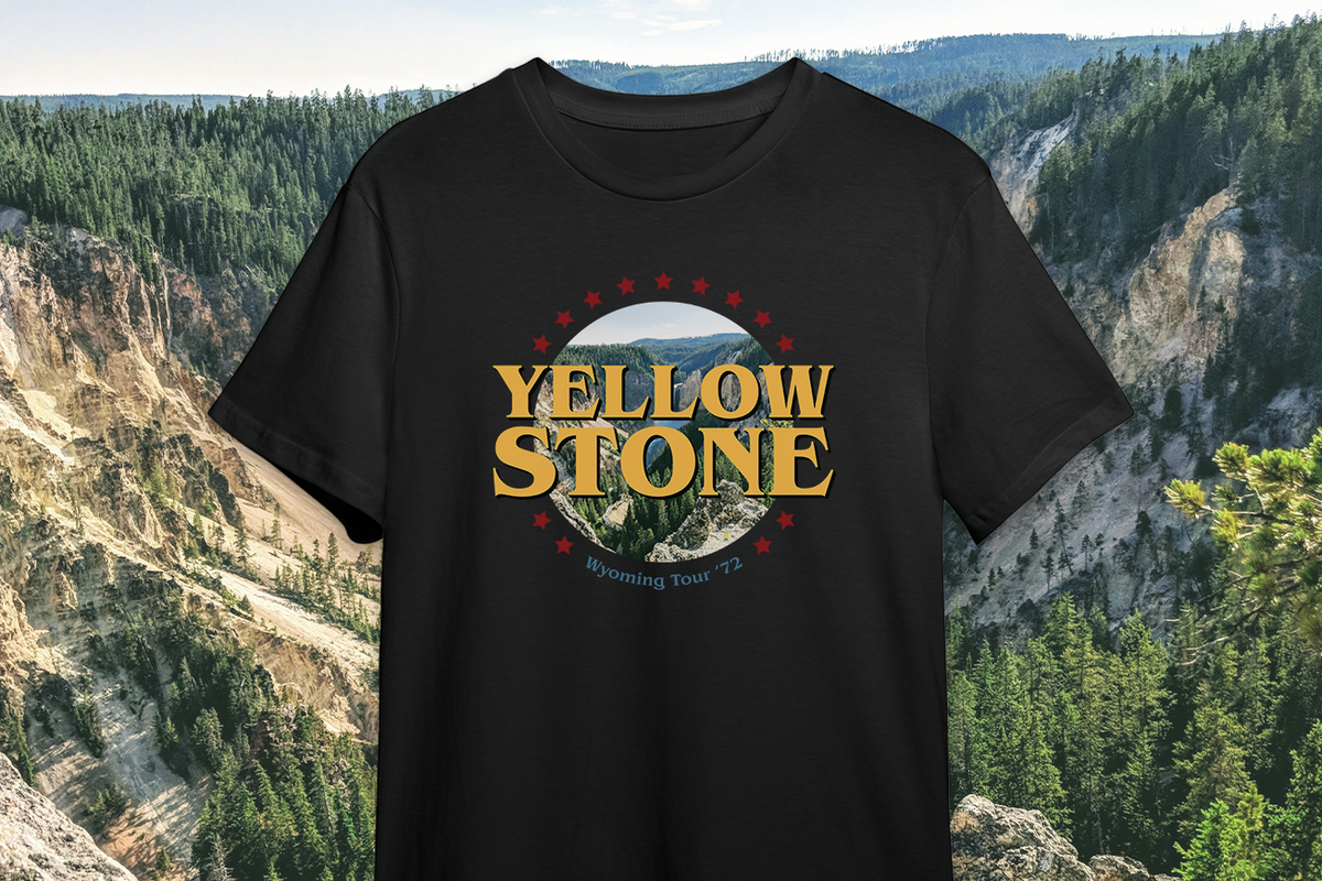 Black t-shirt with 'Yellowstone' graphic design against a natural landscape background