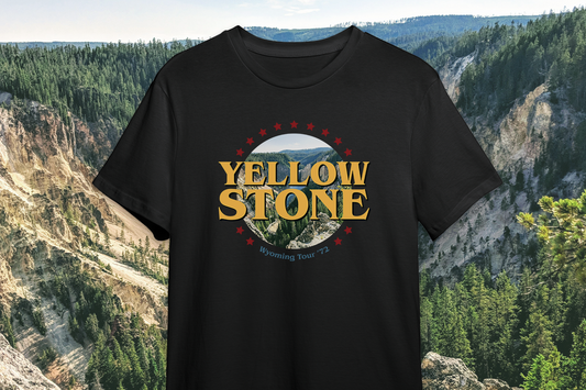 Black t-shirt with 'Yellowstone' graphic design against a natural landscape background