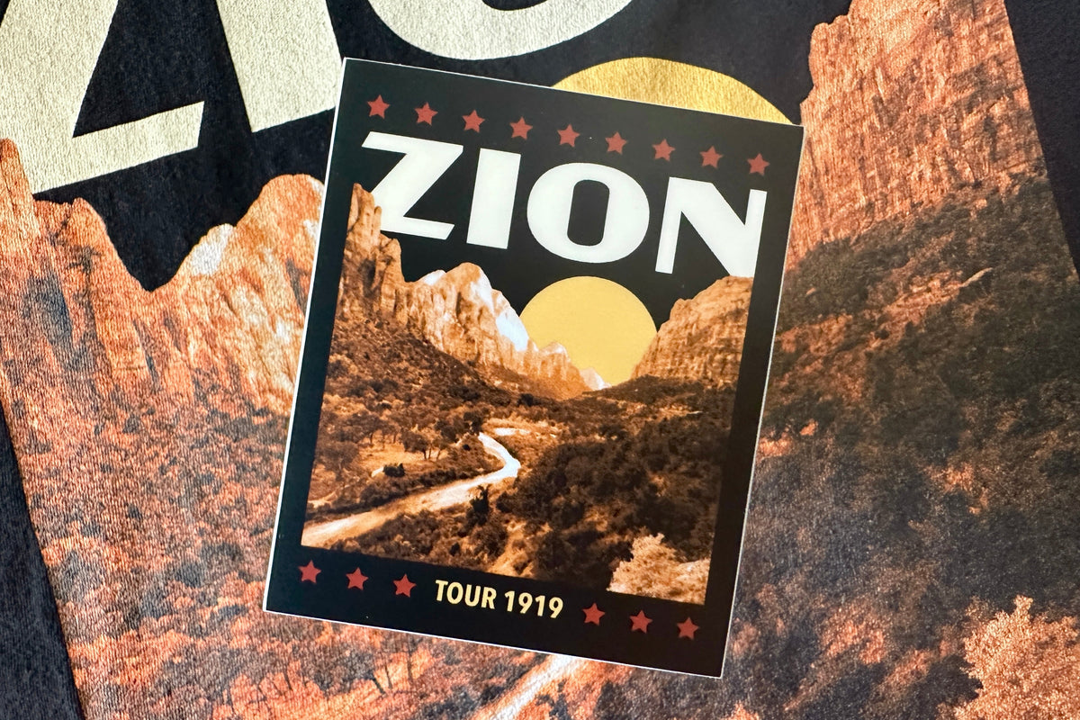 Sticker with a cream colored 'Zion' design, on a textured background